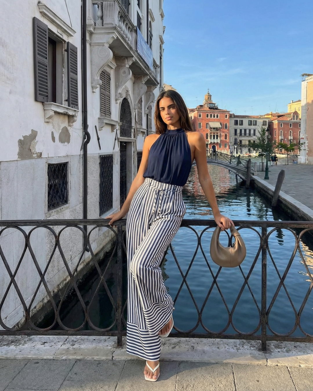 Adeline | Halter Neck Self-Tie Waist Stripe Flowing Wide-Leg Jumpsuit in Navy