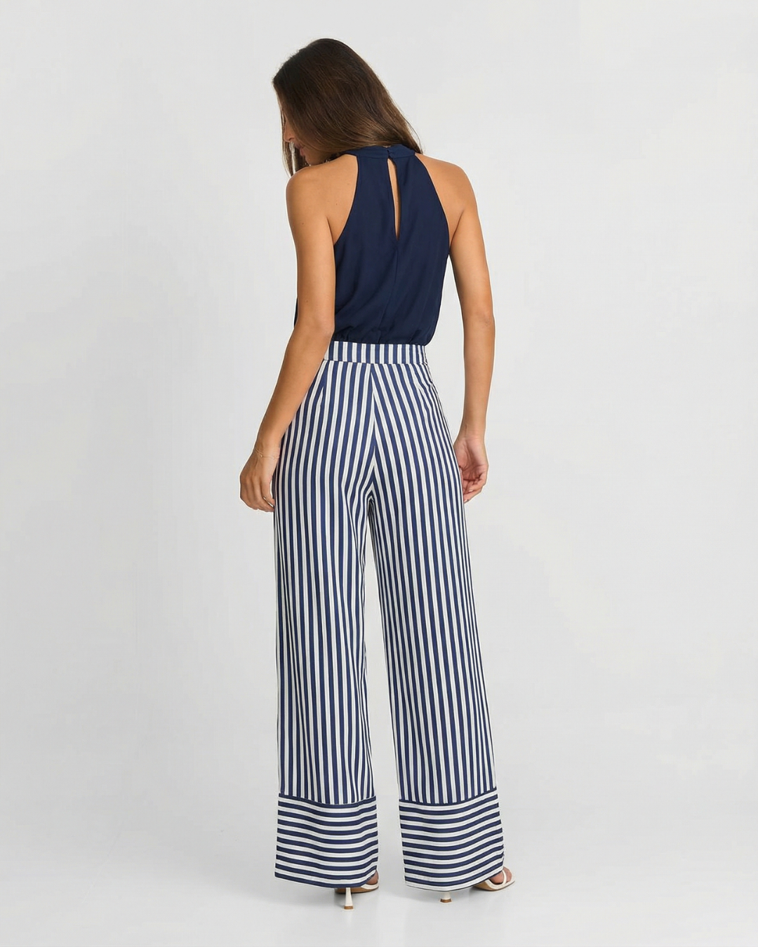 Adeline | Halter Neck Self-Tie Waist Stripe Flowing Wide-Leg Jumpsuit in Navy