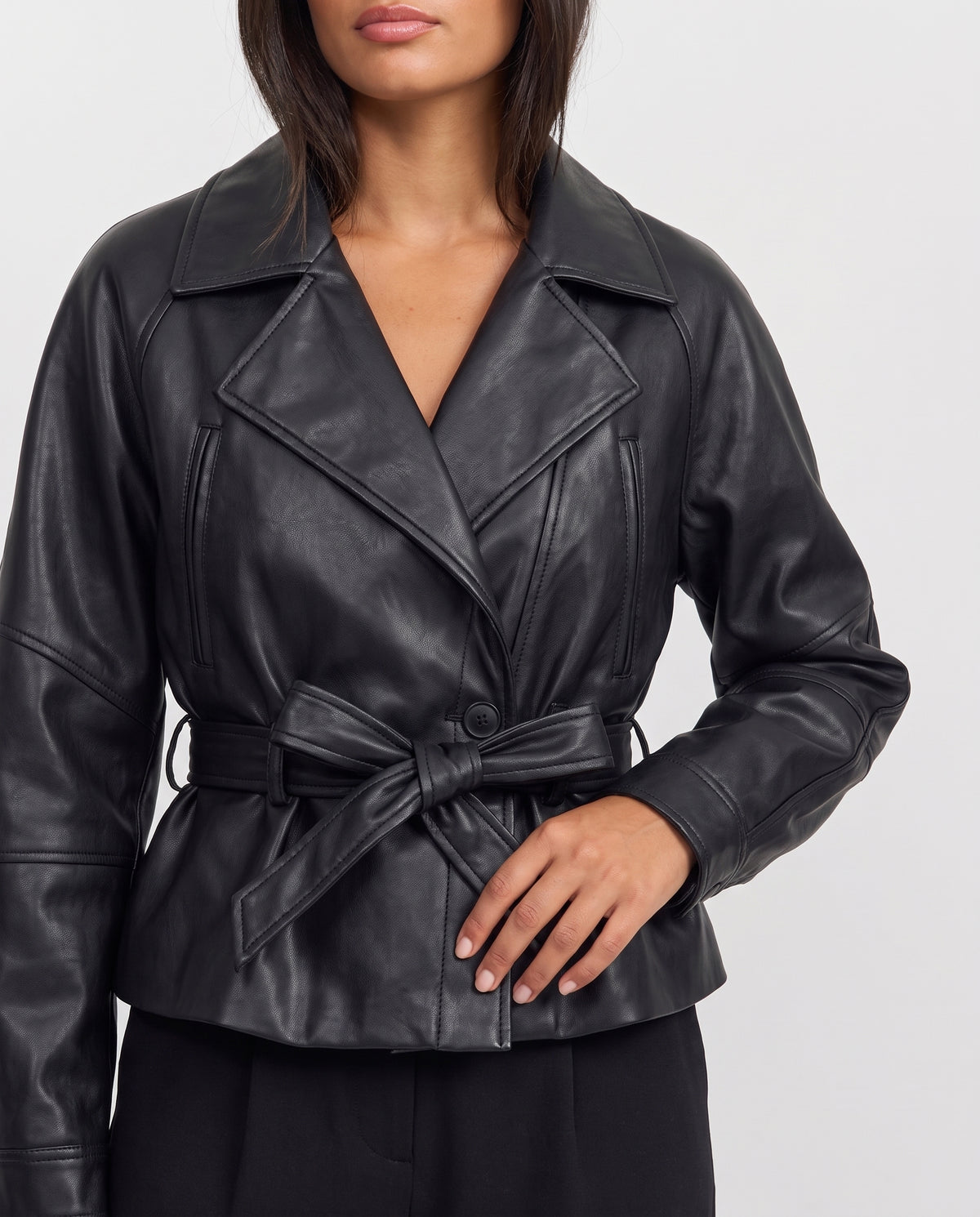 Amber cropped faux leather trench coat close-up