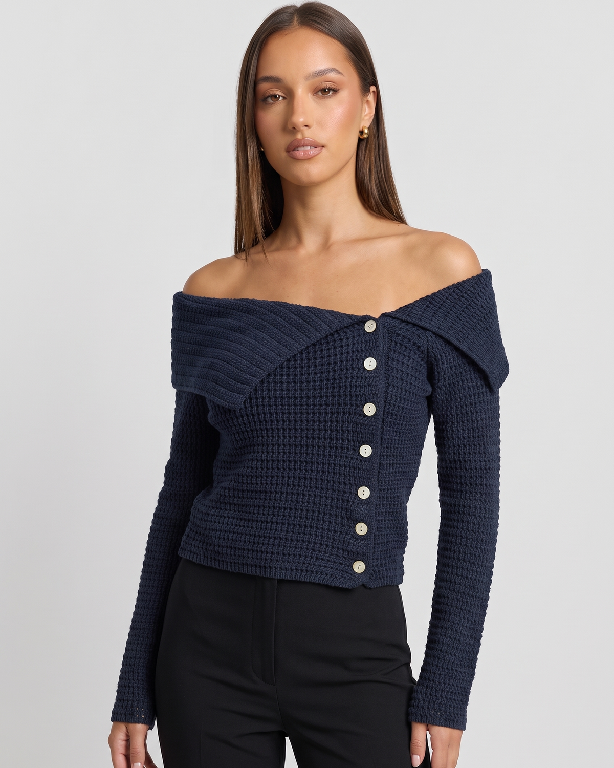 NOLA model wearing off-the-shoulder fitted jumper navy blue