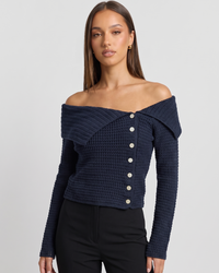 NOLA model wearing off-the-shoulder fitted jumper navy blue