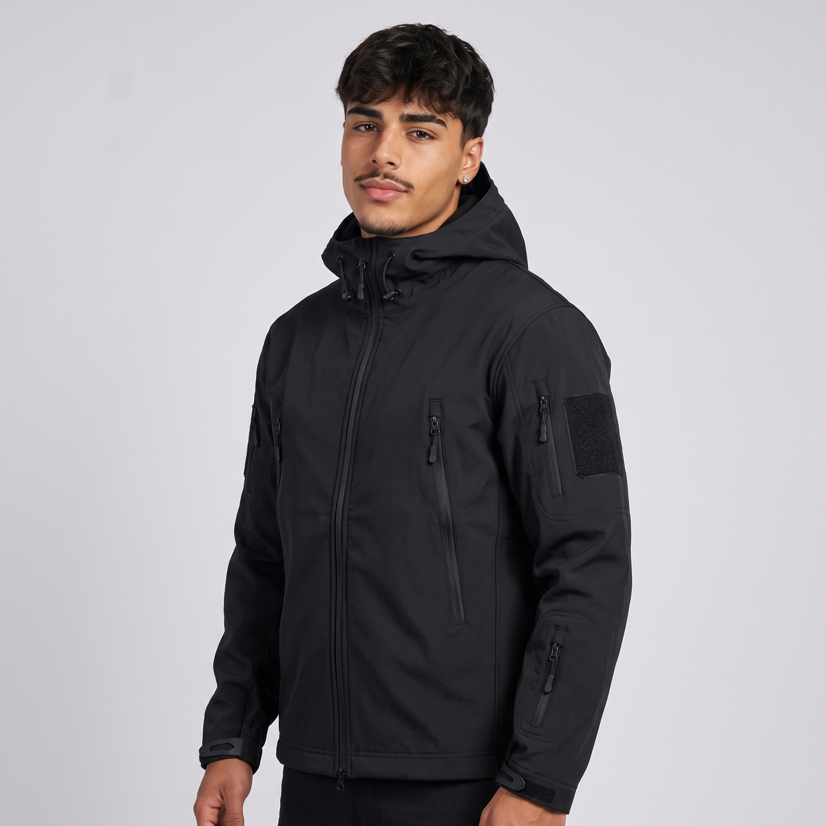 NOLA model wearing all-weather rain jacket hood zipper pockets