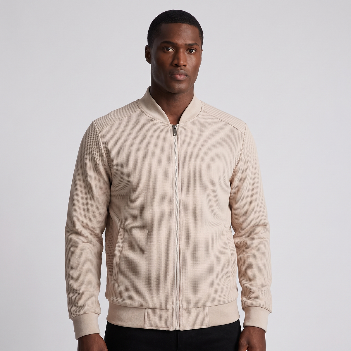 NOLA model wearing slim-fit bomber jacket welt pockets