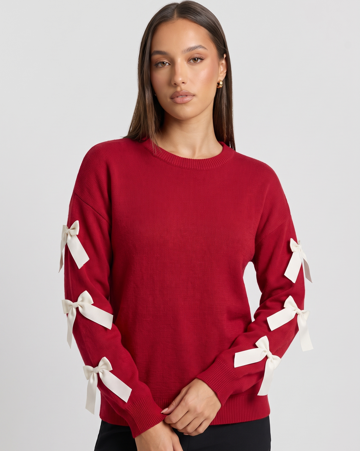 NOLA model wearing red bow sleeve crew neck jumper