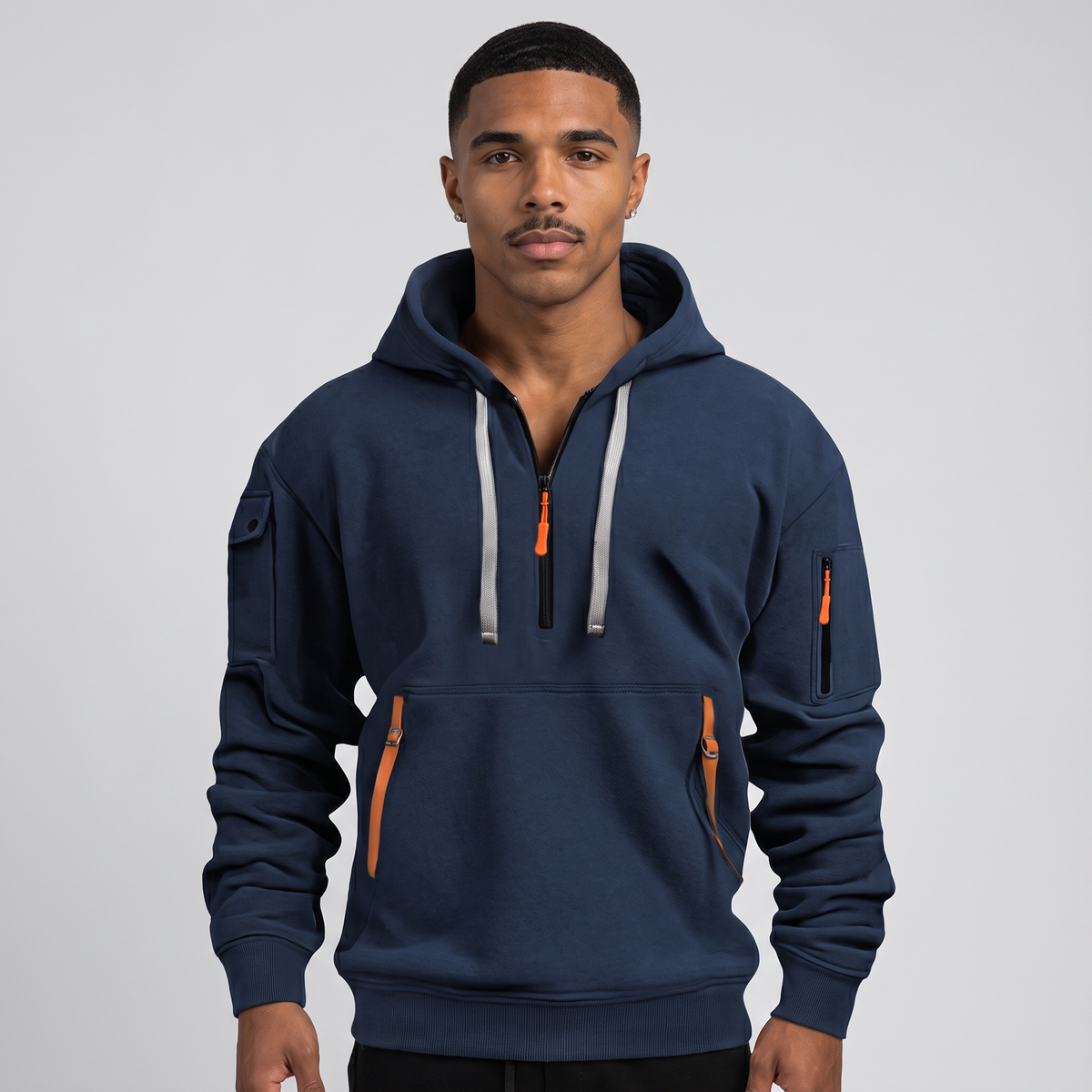 NOLA model wearing hoodie with adjustable hood and zipper pockets