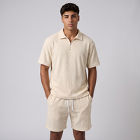 NOLA model wearing ribbed knit quarter zip polo and shorts set