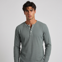 NOLA model wearing long sleeve henley shirt