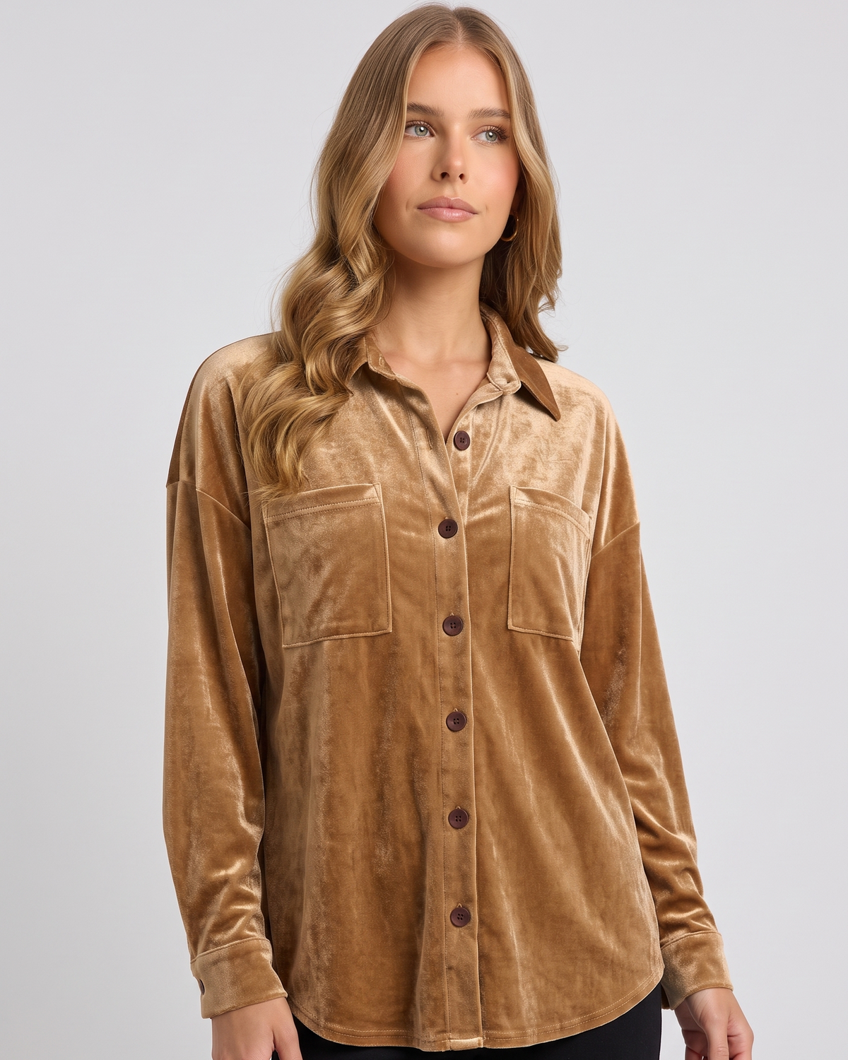 NOLA model wearing velvet button down blouse with front pockets
