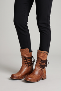 NOLA model wearing lace-up studded boots
