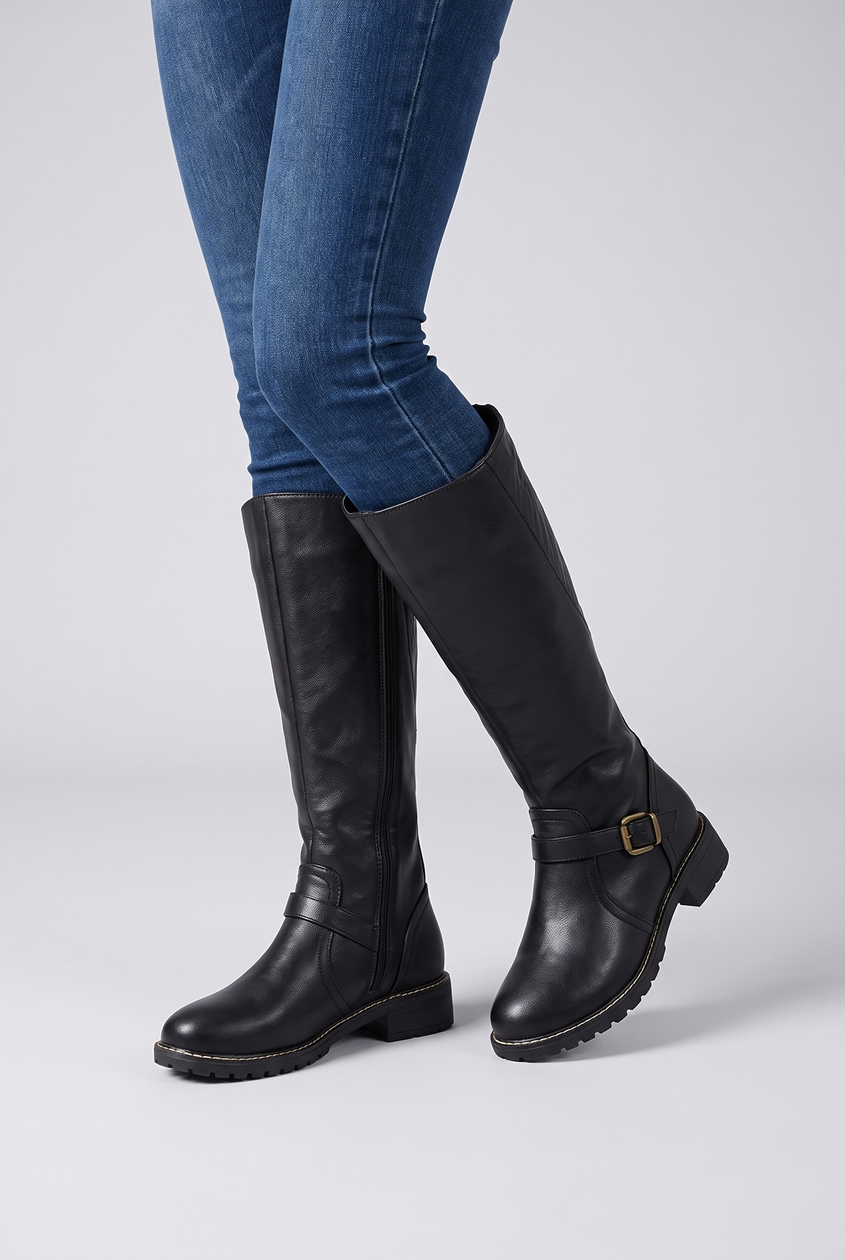NOLA model wearing leather buckle boots