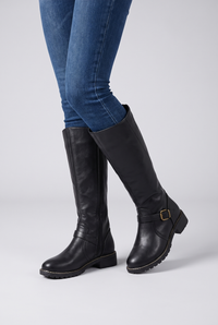 NOLA model wearing leather buckle boots