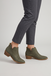 NOLA model wearing pointed toe ankle boots