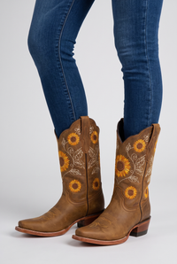NOLA model wearing mid-calf boots