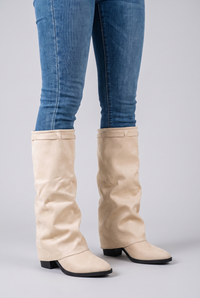 NOLA model wearing mid-calf slouch block heel boots