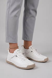NOLA model wearing orthopedic stitched sneakers