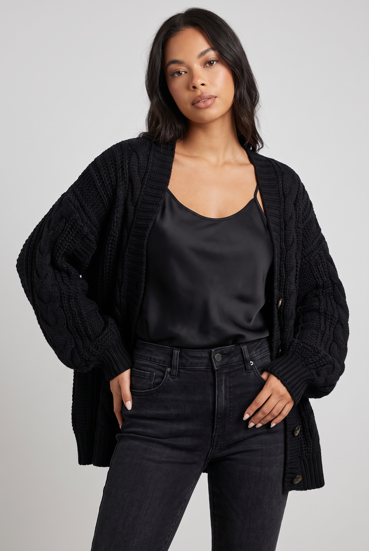 NOLA model wearing oversized cable knit cardigan balloon sleeve black