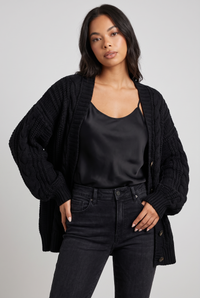 NOLA model wearing oversized cable knit cardigan balloon sleeve black