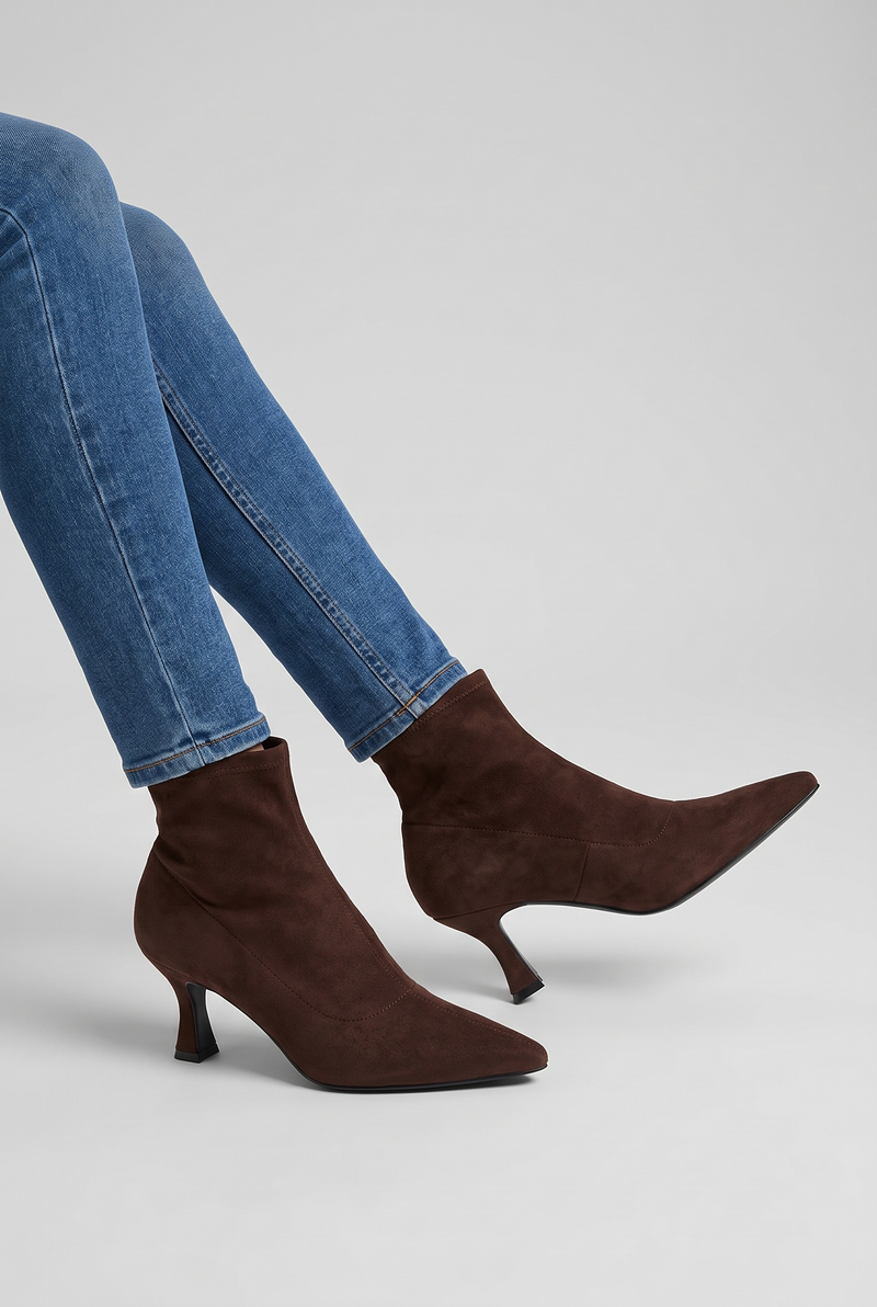 NOLA model wearing pointed toe kitten heel ankle boots