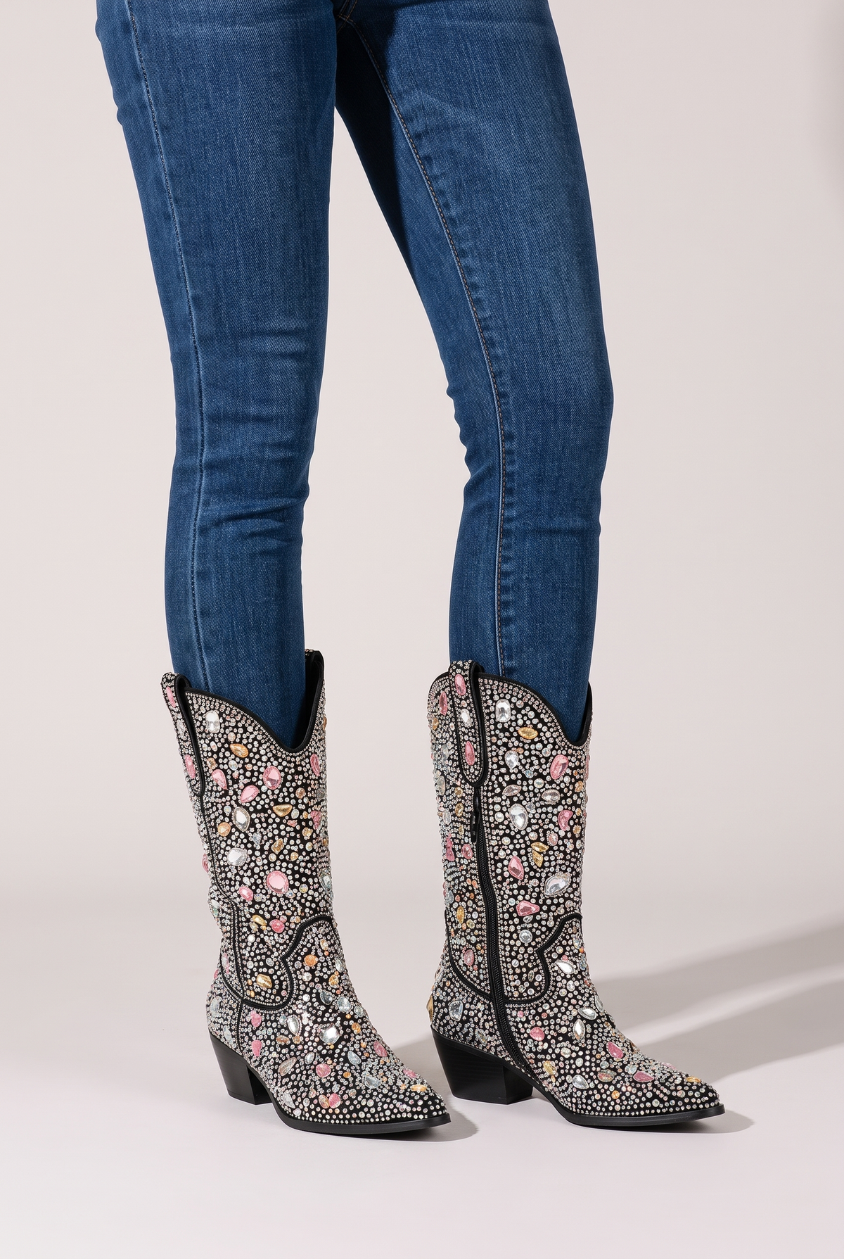 NOLA model wearing black rhinestone mid-calf cowboy boots