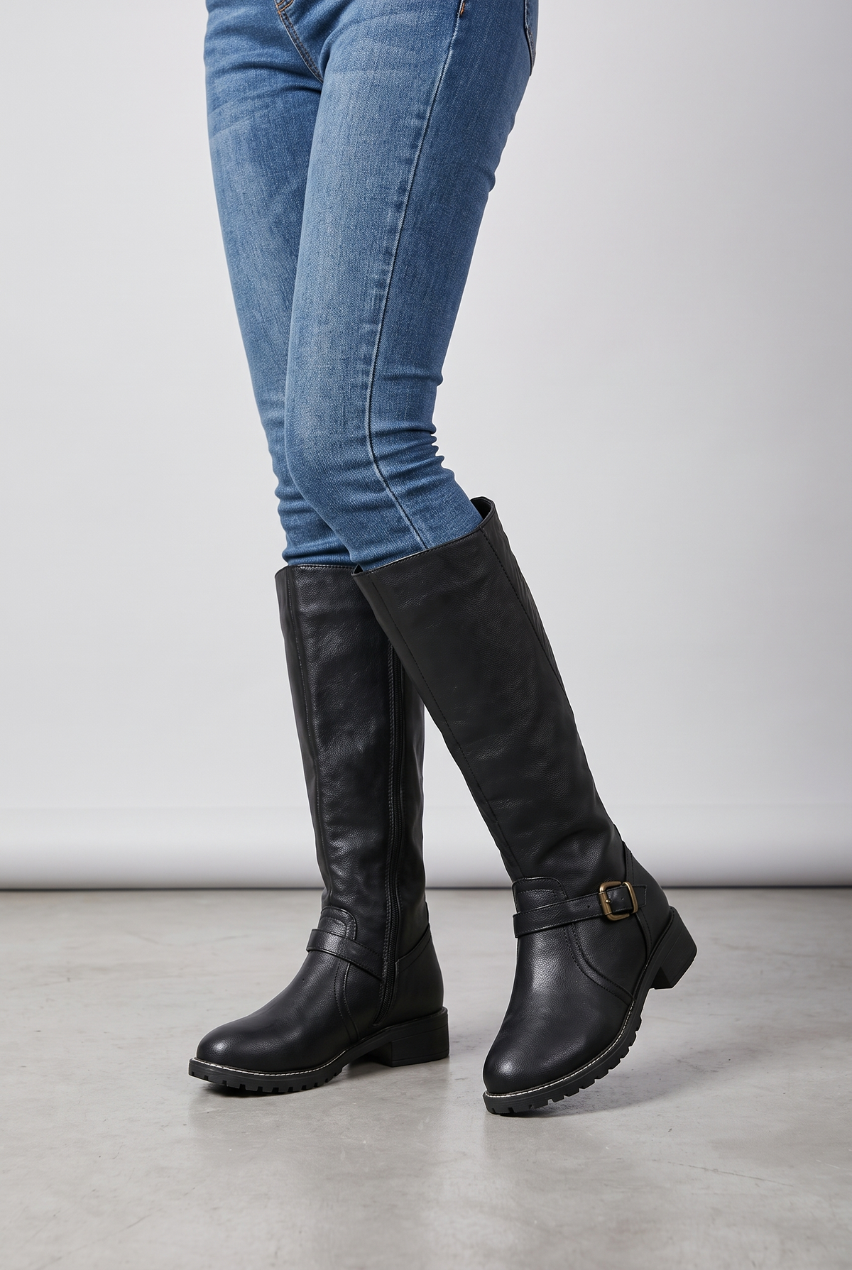 NOLA model wearing leather buckle boots