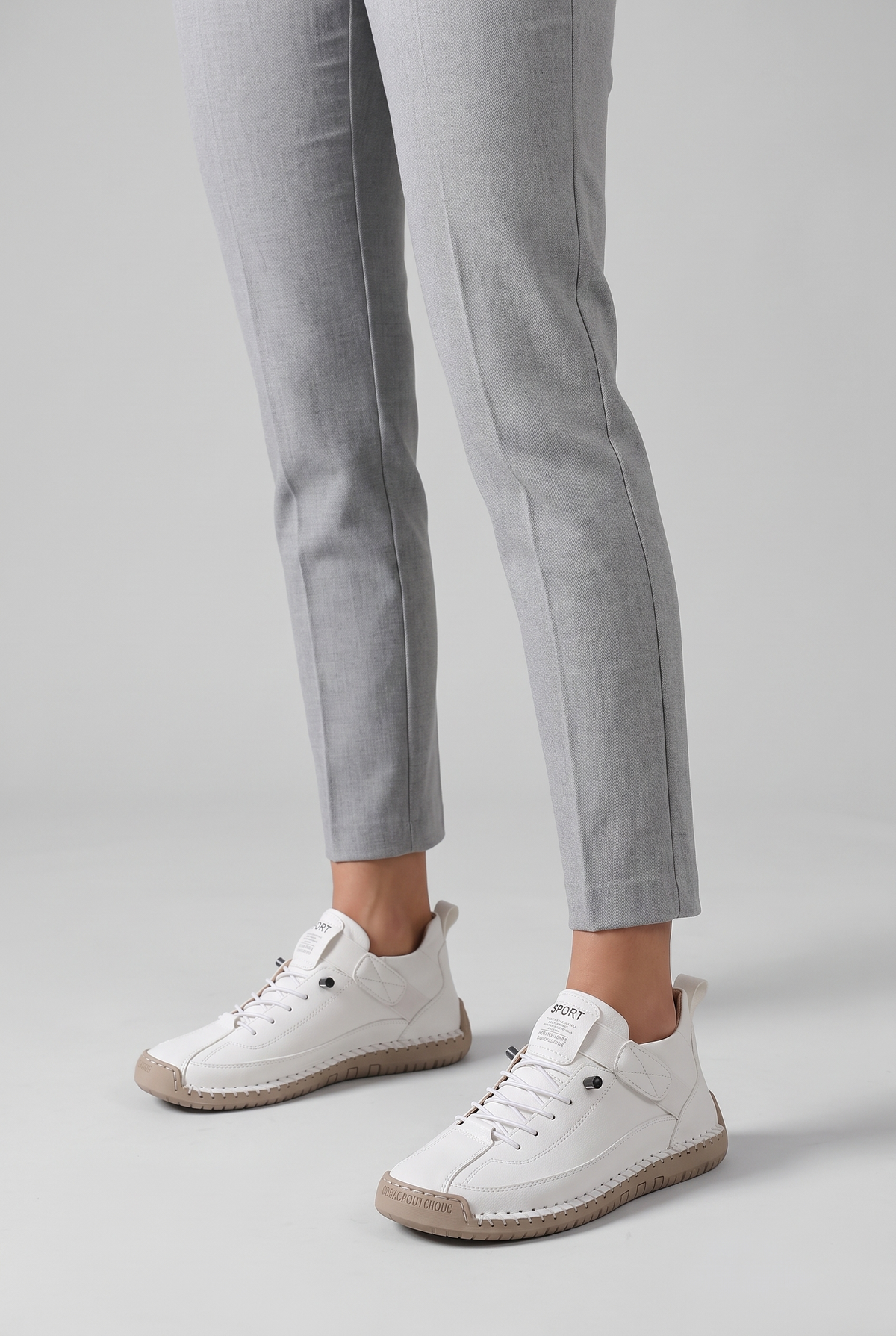 NOLA model wearing orthopedic stitched sneakers