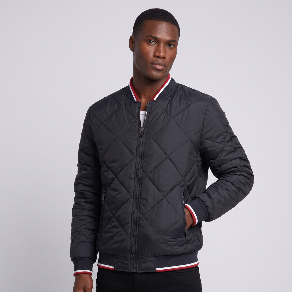 NOLA model wearing black diamond quilted bomber jacket