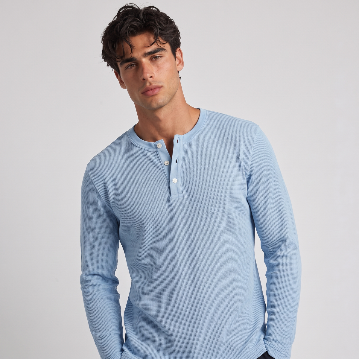 NOLA model wearing long sleeve henley shirt light blue