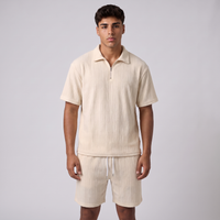 NOLA model wearing ribbed knit quarter zip polo and shorts set
