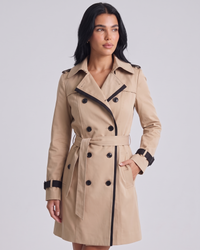 NOLA model wearing belted double-breasted trench coat beige premium pose