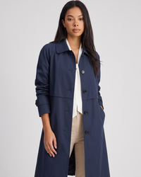 NOLA model wearing button-front mid-length trench coat dark blue and black