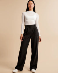 Jolanda high-waisted pleated wide leg trousers in Black